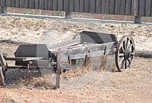 Old wooden cart in the country yard.