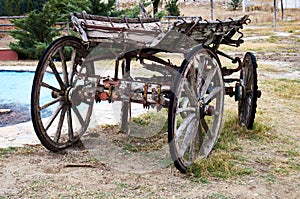 Old wooden cart with four wheel on road