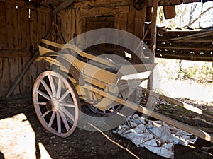 Old wooden cart standing in one old barn