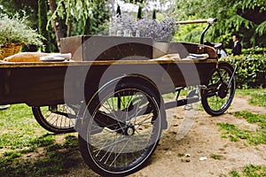 Old wooden cart to transport goods used for decoration at a wedding