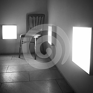 Old wooden chair in modern corridor