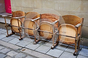 Old wooden chairs,old wooden chairs from a movie theater on the street