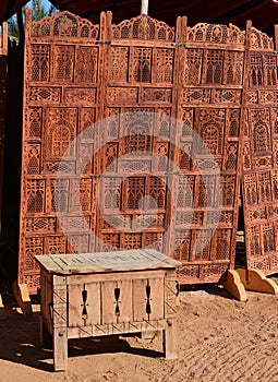 Old wooden chest and folding carved wooden cover partition wall