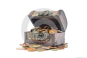 Old wooden chest with golden coins isolated