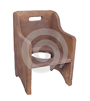 Old wooden child potty chair isolated