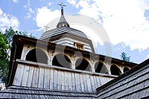 Old wooden church filmed on a bright sunny day
