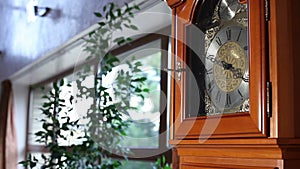 Old wooden clock with pendulum, Old wooden clock with a pendulum, antique wooden clock with a pendulum