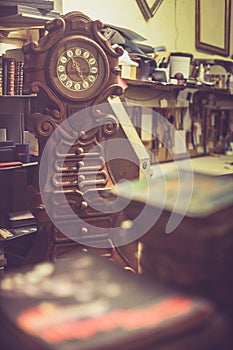 Old wooden clock in a workshop