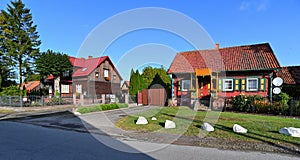 Old wooden colorful historic small living houses in Drewnica, Poland