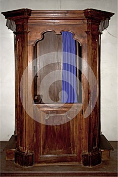 Old wooden confessional photo