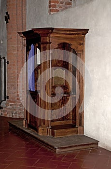 Old wooden confessional photo