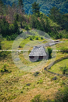 Old wooden cottage in mountain