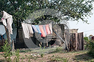 Old wooden country houses with dress at the sun