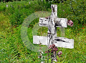 Old wooden cross at a Russian cemetery photo