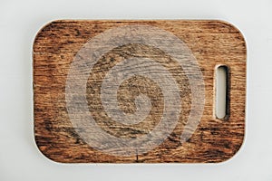 Old wooden cutting board on a white background. Top view. Copy, empty space for text