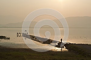 Old wooden dock on Dojran Lake at sunset