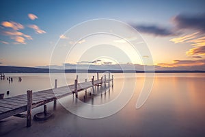 Old wooden dock at the lake, sunset shot