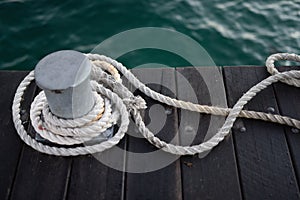 Old wooden dock with shipping rope ties