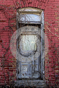 Old wooden door from an abandoned red brick house that has since been torn down, Ottawa, Canada
