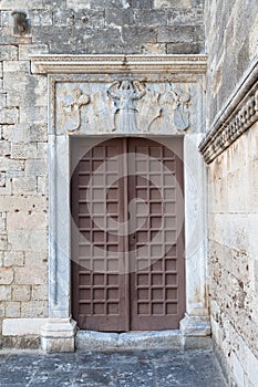 Old wooden door with an angel