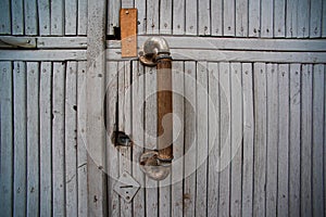 Old wooden door with beams