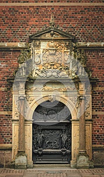 Old wooden door with biblical motives on it