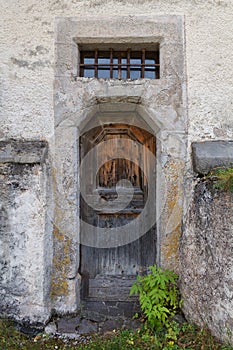 The old wooden door of the church. Rear entrance.