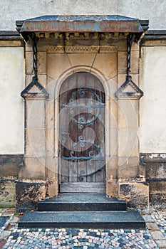 The old wooden door of the church. Rear entrance.