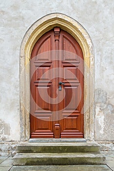 The old wooden door of the church. Rear entrance.