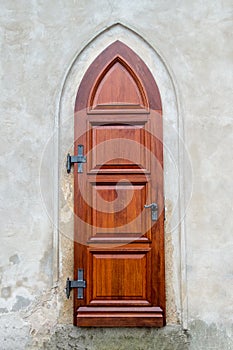 The old wooden door of the church. Rear entrance.