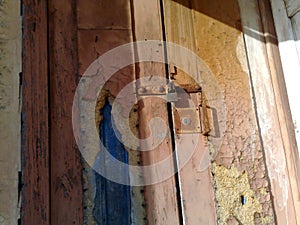 Old wooden door with clasp