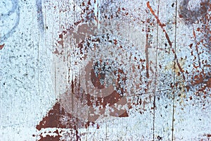Old wooden door covered in paint stains; background texture