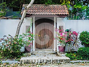 Old wooden door decorated with flowers