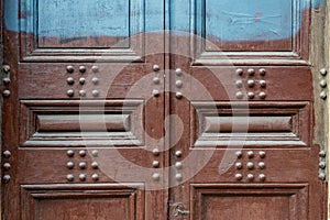 Old wooden door, detail. Handles, lock, for texture and background