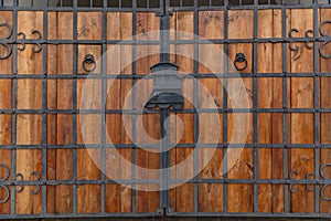 Wooden texture of old doors with forging elements