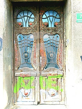 Old wooden door with glass and metalic handle