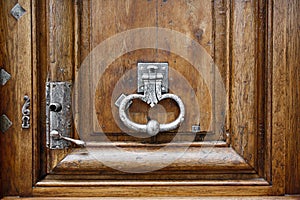 Old wooden door with metal handle knocker