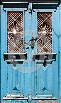 Old wooden door with metal ornaments