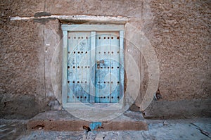 Old wooden door in Mirbat, Dhofar Salalah, Oman photo