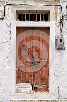 Old wooden door of an old house in Paxoi island, Greece