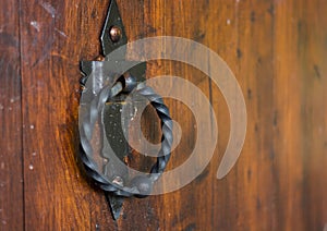 Old wooden door with round brass handles