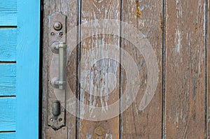 Old wooden door and rusty iron lock