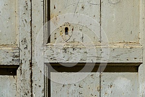 An old wooden door with a rusty lock.