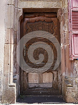 Old wooden door with sandstones