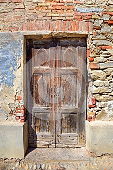 Old wooden door. Serralunga D'Alba, Italy. photo