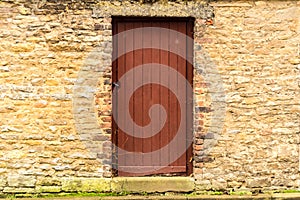 Old wooden door in the stone