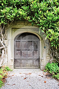 Old Wooden Door with Stone archway in English Manor House