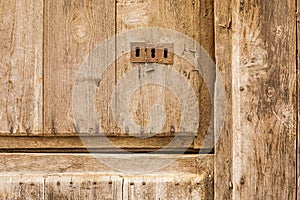 An old wooden door with three locks