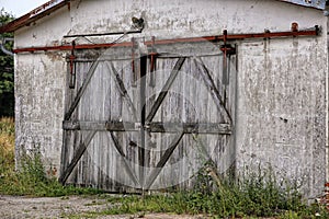 Old wooden door of walled barn