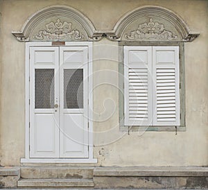 Old wooden door and window in Sino-Portuguese style at old town